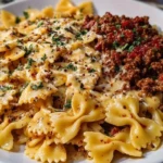 Cheesy Bowtie Pasta with Savory Cajun Ground Beef in Garlic Cream