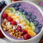 Rainbow Smoothie Bowls topped with fresh fruit & granola - 1